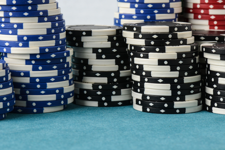 Stacked Poker Chips with White Backgroundの写真素材