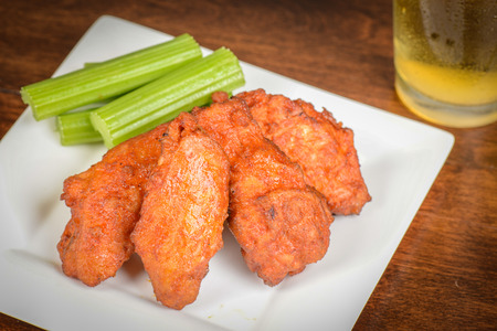Chicken Buffalo Wings with Celery Sticks and Beerの写真素材