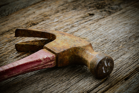 hammer on rustic hardwood floorの写真素材