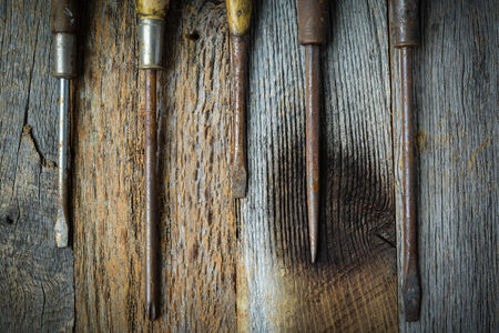 Rustic Screwdrivers on Wood Backgroundの写真素材