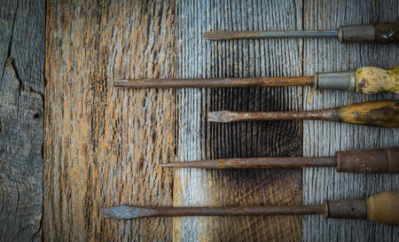 Rustic Screwdrivers on Wood Backgroundの写真素材