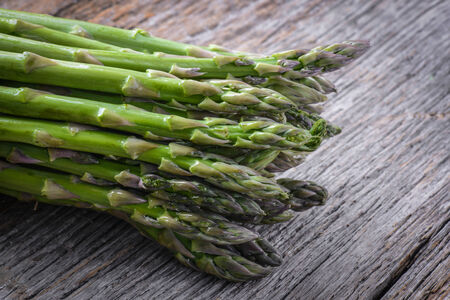 Fresh Asparagus on Rustic Wood Backgroundの写真素材