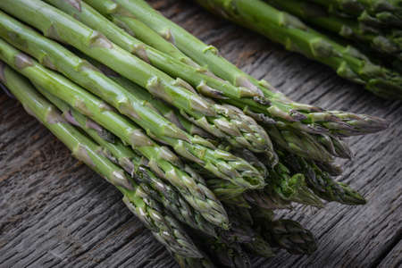 Fresh Asparagus on Rustic Wood Backgroundの写真素材
