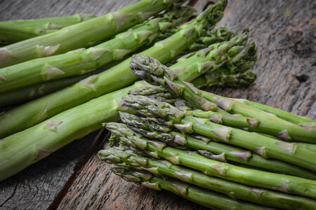 Fresh Asparagus on Rustic Wood Backgroundの写真素材