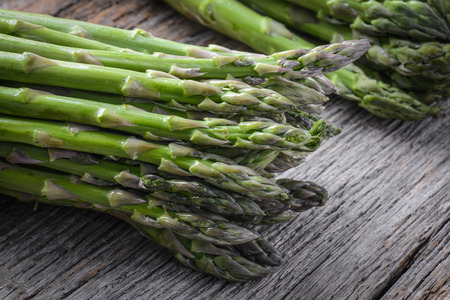 Fresh Asparagus on Rustic Wood Backgroundの写真素材