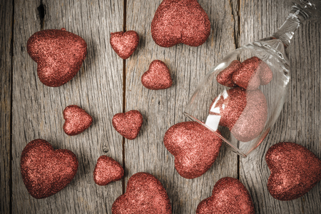 Wine Glass with Red Hearts on Valentine's Dayの写真素材