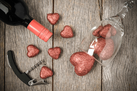 Wine Glass, Corkscrew and Wine with Red Hearts on Valentine's Dayの写真素材