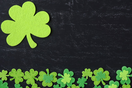 Green Clovers on Chalkboard Background Background for St. Patrick's Day Holidayの写真素材
