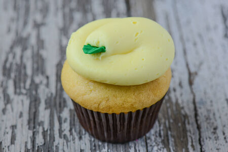 Lemon Cupcake on Wood Backgroundの写真素材