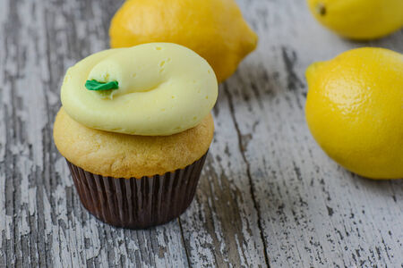 Lemon Cupcakes with Fresh Lemonsの写真素材