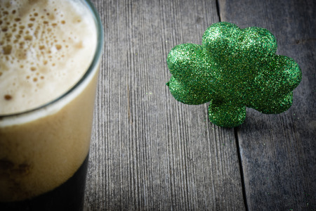 Pint of Stout Beer with Green Shamrock
