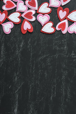 Red Hearts on a Chalkboard for Valentines Dayの写真素材