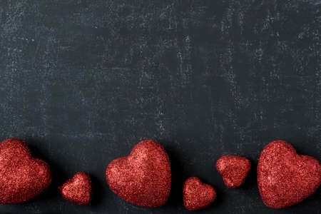 Red Hearts on a Chalkboard for Valentines Dayの写真素材