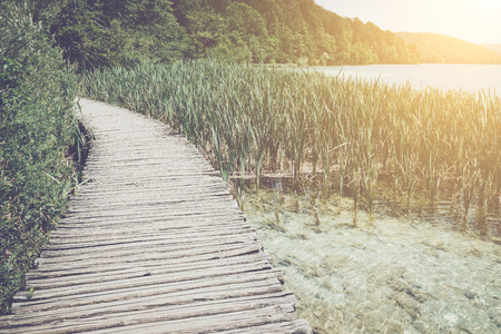 Wooden Bridge over a Lake in Plitvice National Parkの写真素材