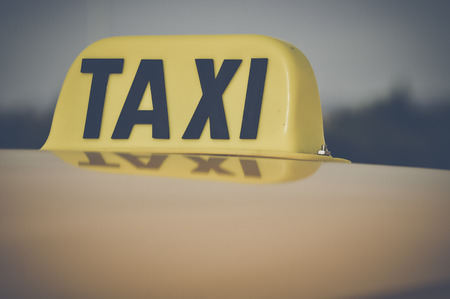 Taxi Cab Car Roof Sign Close Up in Retro Film Styleの写真素材