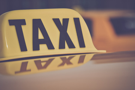 Taxi Cab Car Roof Sign Close Up in Retro Film Styleの写真素材