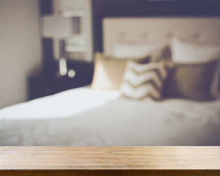 Blurred Bedroom with Bed and Nightstand with Reto Style Filterの写真素材