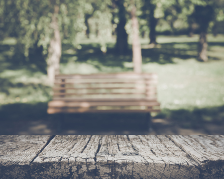 Blurred Park Bench with Nature Backgroundの写真素材