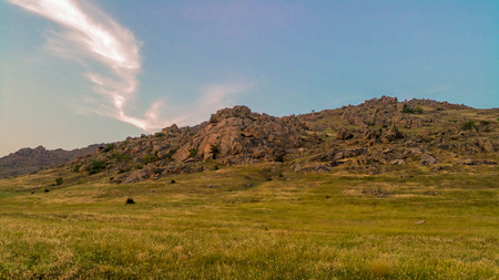 Landscape - plain and mountains in the sunsetの写真素材