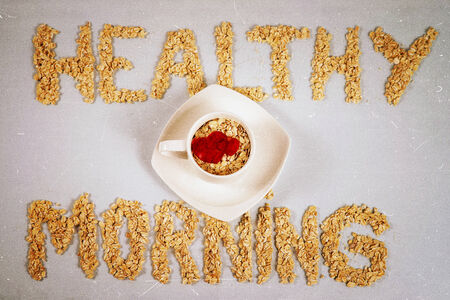 Healthy morning with oat flakes and white cupの写真素材