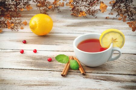 Cup of tea with cranberry and lemonの写真素材