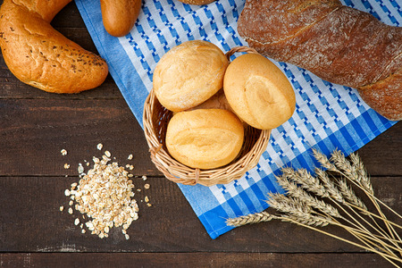 Bread products on the tablecloth and oat groatsの写真素材