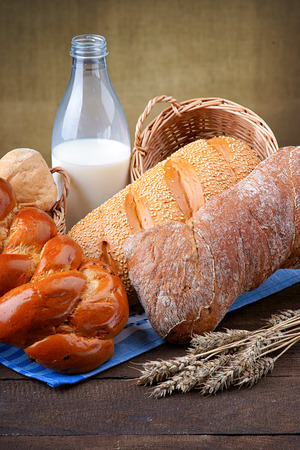 Bottle of milk and fresh baked breadの写真素材