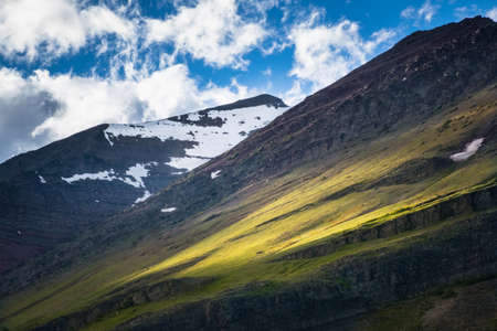 Sunrise into the field of mountains at Glacier national parkの写真素材