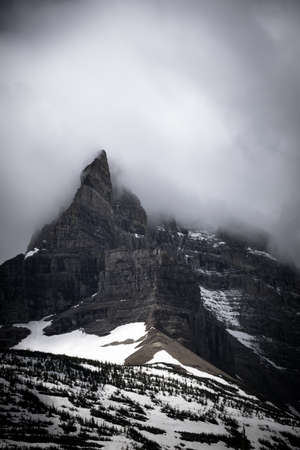 cloud on the top of the mountain at Glacier national parkの写真素材