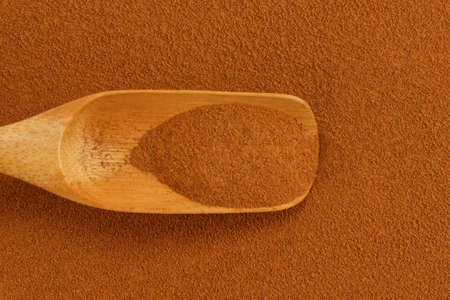 Ground cinnamon powder and bamboo gauge scoopの写真素材