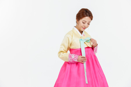 Portrait of Asian Three Generation Family in Hanbok, Korean Traditional Clothesの写真素材
