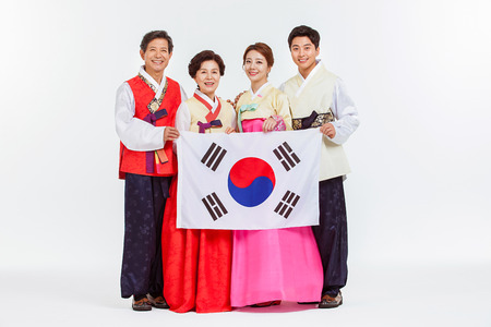 Portrait of Asian Three Generation Family in Hanbok, Korean Traditional Clothesの写真素材