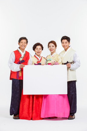 Portrait of Asian Three Generation Family in Hanbok, Korean Traditional Clothesの写真素材