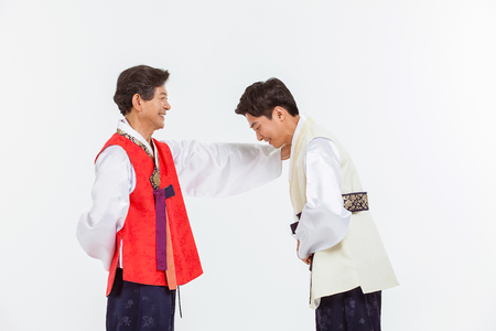 Portrait of Asian Three Generation Family in Hanbok, Korean Traditional Clothesの写真素材