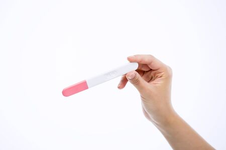 Asian Woman with Pregnancy Testの写真素材