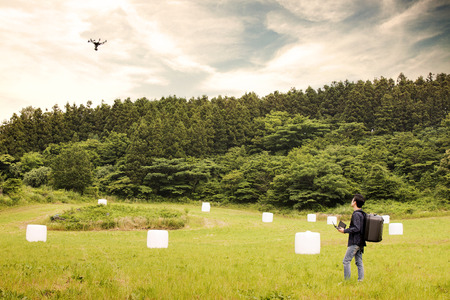 Asian Man Flying Drone