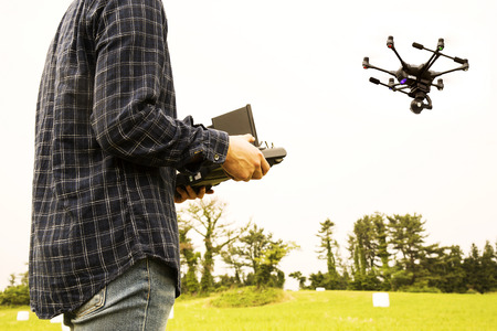 Asian Man Flying Drone