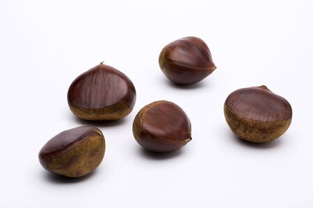 A Few Chestnuts Scattered, Isolated on Whiteの写真素材