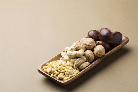 Different Types of Nuts on a Wooden Tray