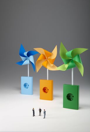 Green, orange and blue wind vanes isolatedの写真素材