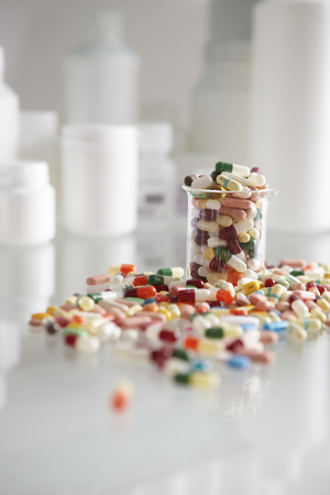 Too many pills in a beakerのeditorial素材