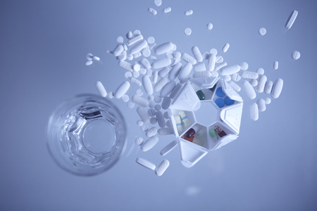 Pills and a glass of waterのeditorial素材