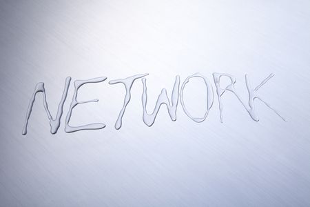 Network spelled out in waterの写真素材