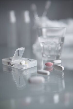 Pills and a glass of waterのeditorial素材
