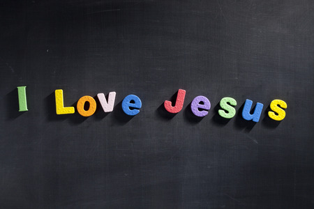 Magnetic letters on blackboard spelling out I Love Jesusの写真素材