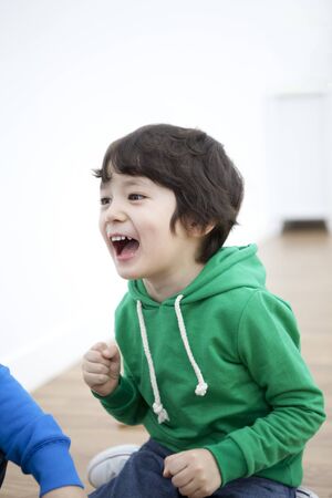 A child playing with a friendの写真素材