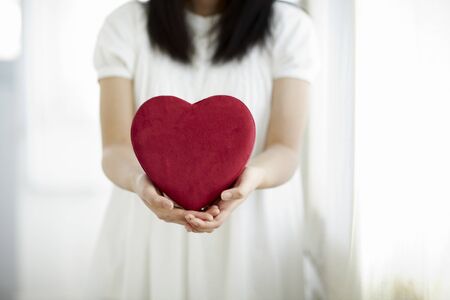 A heart-shaped box filled with loveの写真素材