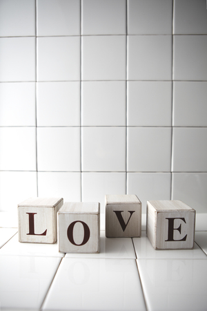 Four wooden blocks that spell out LOVEの写真素材