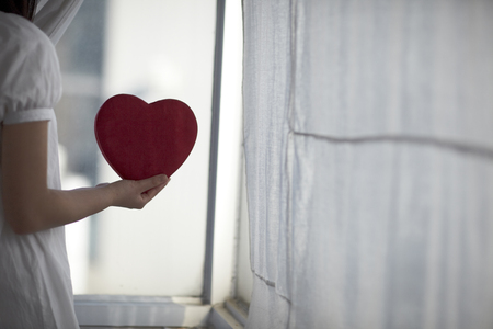 A heart-shaped box filled with loveの写真素材