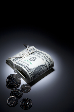 Money presented in a dark settingの写真素材